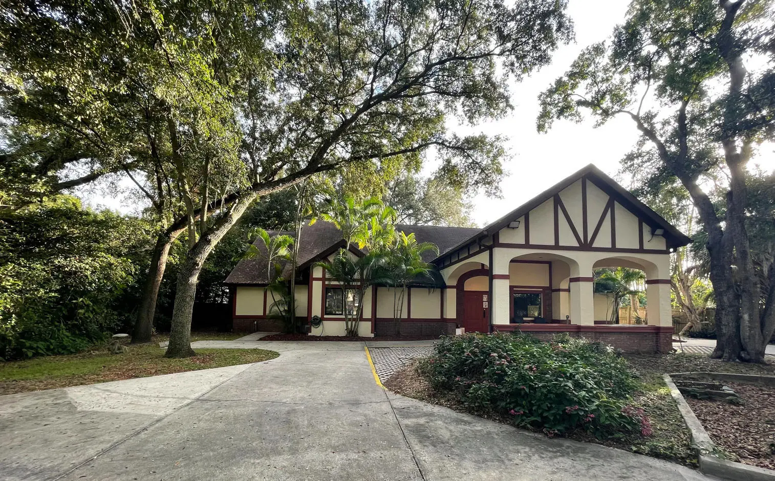 A large house with trees in the background